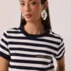 Camiseta listrada azul em algodão com bordado dourado Made in Brasil no peito, gola e mangas em ribana larga